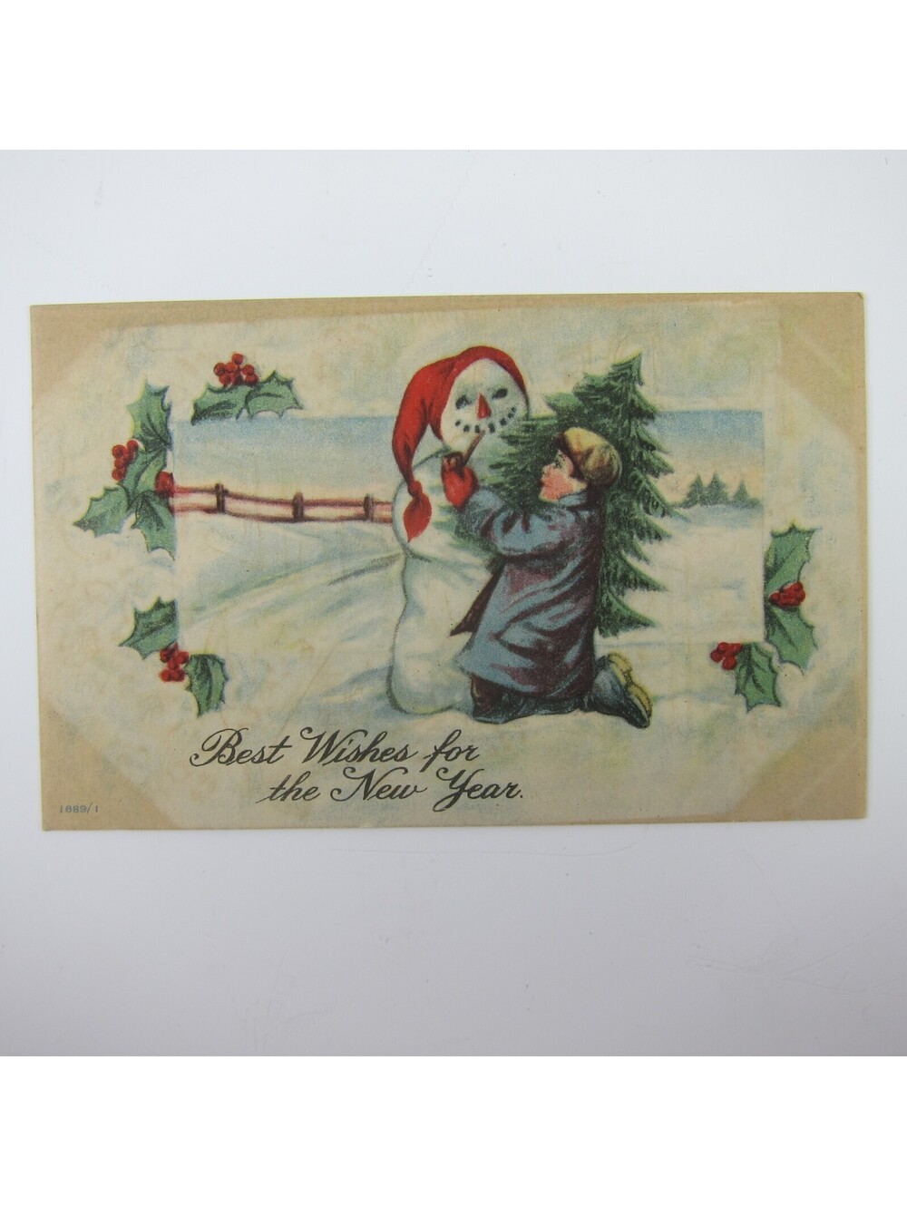 Postcard New Years Boy Gives Pipe to Snowman Tree Holly Berries Snow Antique
